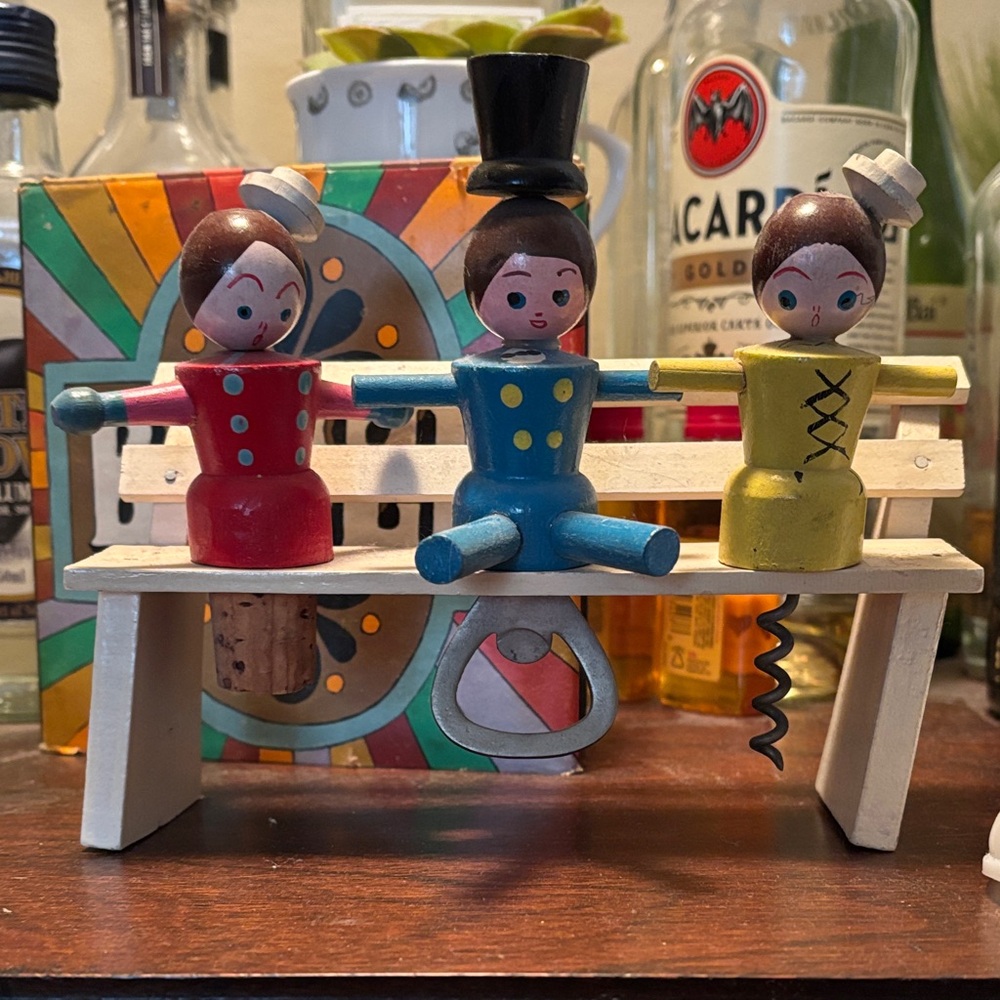 Vintage Ladies and gent on a bench bottle opener bar set